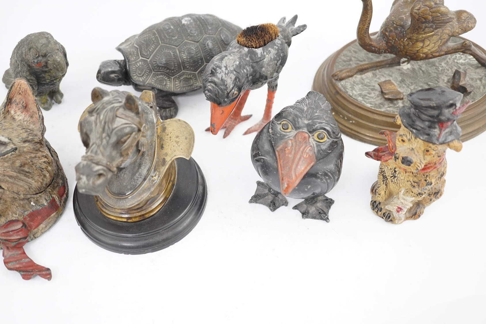 A collection ten 19th and 20th century novelty animal bronze and metal ink wells, including a Martin Brothers style ‘Wally’ inkwell